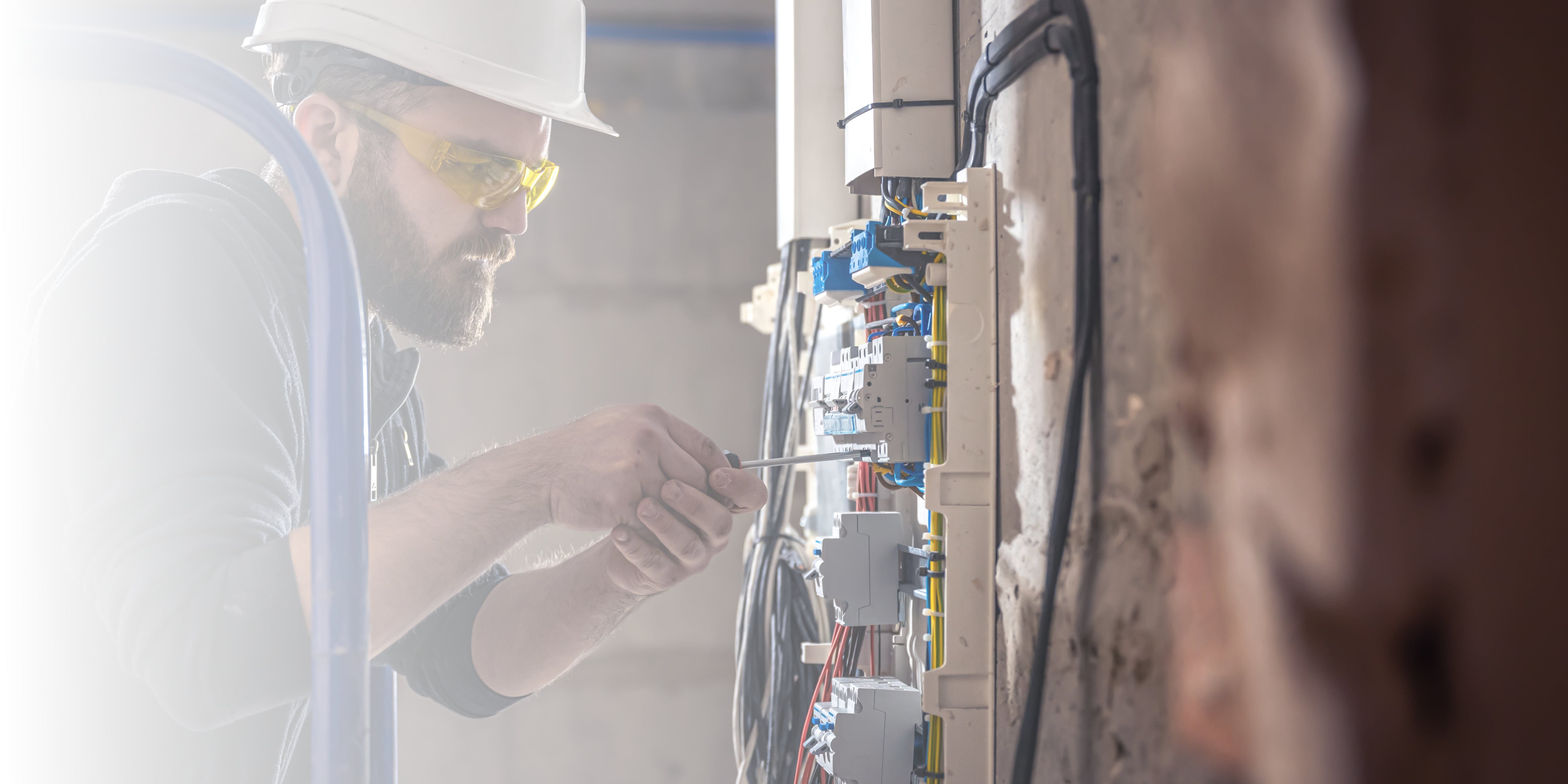 Expert Electrician fixing wiring in an apartment inNottingham