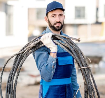 Experienced electrician repairing and restoring electrical light for optimal performance and safety